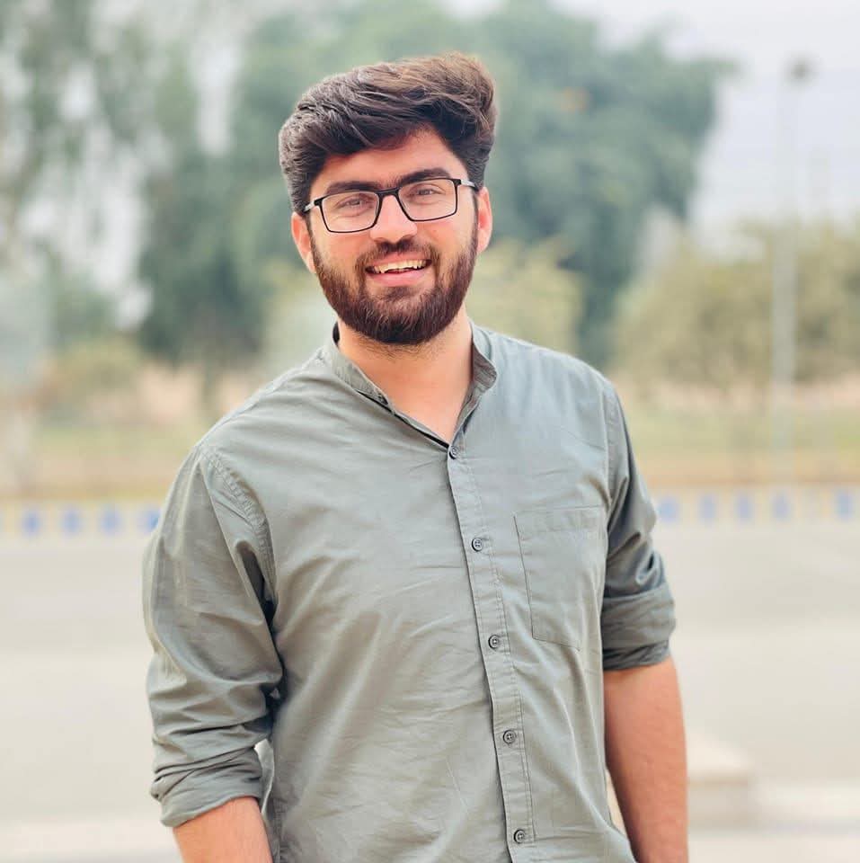Dr. Mukaram Faiz smiling in Shalwar Kameez
